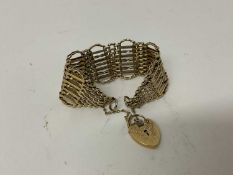 9ct yellow gold gate bracelet with heart shaped padlock clasp