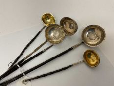 Group of five Georgian silver toddy ladles with whalebone handles, to include a pair (London 1802) a