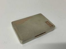 Good quality George VI silver tobacco box of rectangular form with engine turned decoration and gild