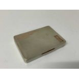 Good quality George VI silver tobacco box of rectangular form with engine turned decoration and gild