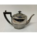 George V silver teapot with fluted decoration and ebonised handle and finial, (Sheffield 1910), make