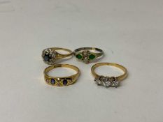 18ct gold diamond three stone ring, together with three other 18ct gold and gem-set dress rings (4)