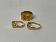 Edwardian 18ct gold band ring, (London 1908), ring size Q, together with two other 18ct gold rings (