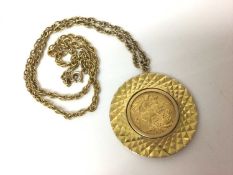 George V gold full sovereign, 1912, in yellow metal disc pendant mount on yellow metal chain