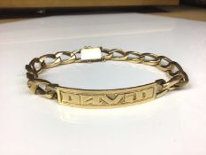 Eastern yellow metal identity bracelet engraved 'David'