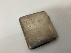 Local interest- George V silver cigarette case of rectangular form with engine turned decoration and