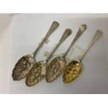 Four Georgian and later silver table spoons, with later embossed and chased decoration as 'berry spo