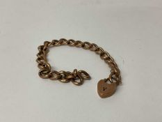 Late Victorian 9ct rose gold curb link bracelet with heart shaped padlock clasp, (Birmingham 1897).