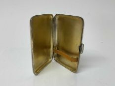 Edwardian silver cigarette case of rectangular form with gilded interior, (Sheffield 1906), maker J