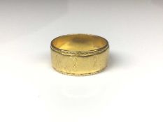 22ct gold wide band wedding ring with engraved geometric decoration