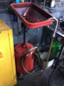Portable oil draining system with red bottle
