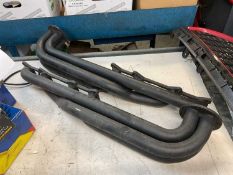 Pair of new old stock TVR exhaust manifolds believed to come from a Pre Cat Griffith.