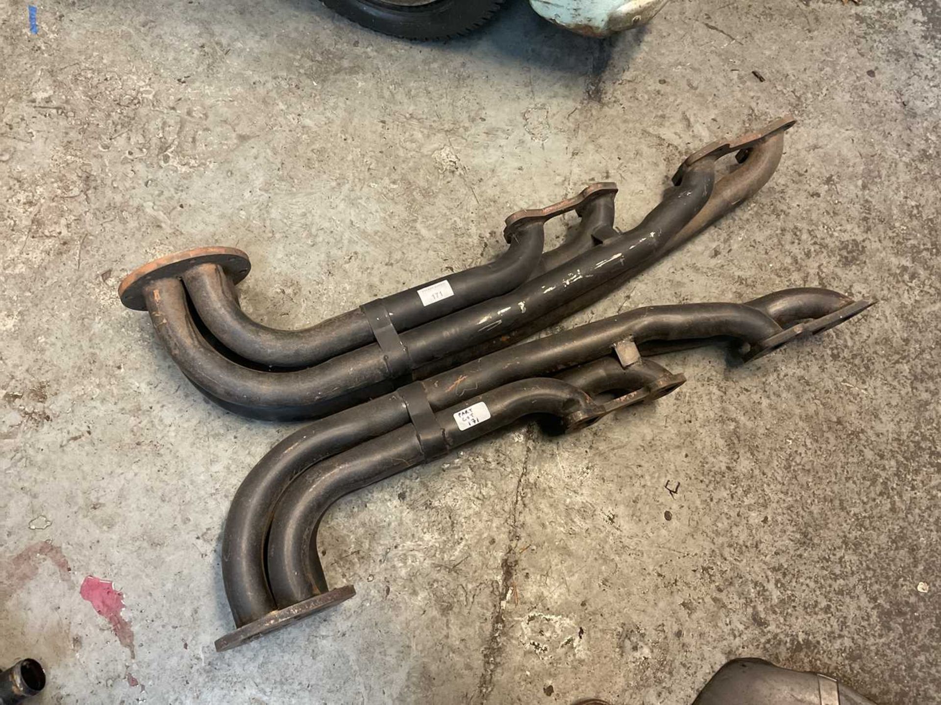 Pair of new old stock TVR exhaust manifolds believed to come from a Pre Cat Griffith.