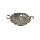 Silver twin-handled bowl, probably American, of foliate form with flower decoration in relief, marke