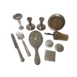 Group of silver, mostly dressing table items, including a pair of weighted candlesticks, a weighted