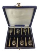 Cased set of six silver gilt teaspoons decorated with black and white enamelling, Birmingham 1975 (T