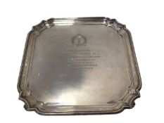 Silver salver, of square shape with pie crust rim, on four scroll feet, with Royal Observer Corps pr