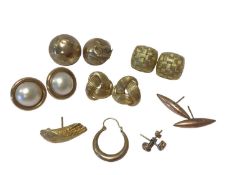 Various pairs of gold earrings