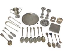 Group of silver, including two pairs of Georgian sugar tongs, a small salver, a cigarette case, napk