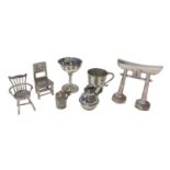 Group of miniature silver items, including a goblet and mug, two chairs, a jug, a tankard marked .90