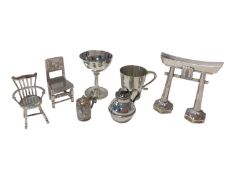 Group of miniature silver items, including a goblet and mug, two chairs, a jug, a tankard marked .90