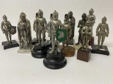 A terrifying assemblage of vintage suit of armour table lighters