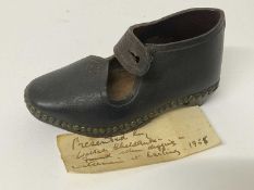 Mysterious leather child's clog with note of provenance ''Presented by Walter Sheldrake, found when