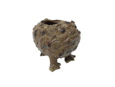 A grotesque three-legged pottery toad