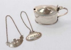 Late Victorian silver oval mustard pot and two decanter labels
