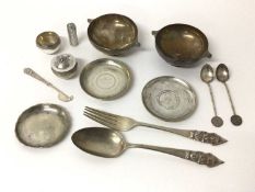 A group of Eastern silver and white metal, including a pair of engraved Indian bowls, a salt and pep