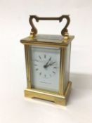 A Thomas Russell & Son brass cased carriage clock with key