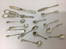 Mixed group of Georgian and later silver condiment spoons, sugar tongs, plated grape scissors and ot