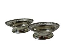 Pair of George V silver salts of navette form with pierced borders, on oval feet with beaded borders