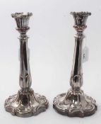 Pair early 19th century Old Sheffield Plate candlesticks, with octagonal leaf mounted stems, urn can