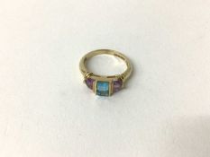 Amethyst and blue topaz three-stone ring
