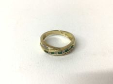 Emerald and diamond ring with a cross-over design