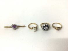 Group of three 9ct gold dress rings and a 9ct gold and amethyst brooch (4)