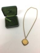 Edward VII 1907 gold full sovereign in a 9ct gold pendant mount on a 9ct gold chain.