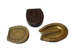 Three Victorian novelty Vesta cases in the form of horse hooves comprising two brass and a Vulcanite