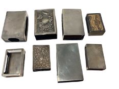 Eight silver and Eastern white metal match box holders various (8)