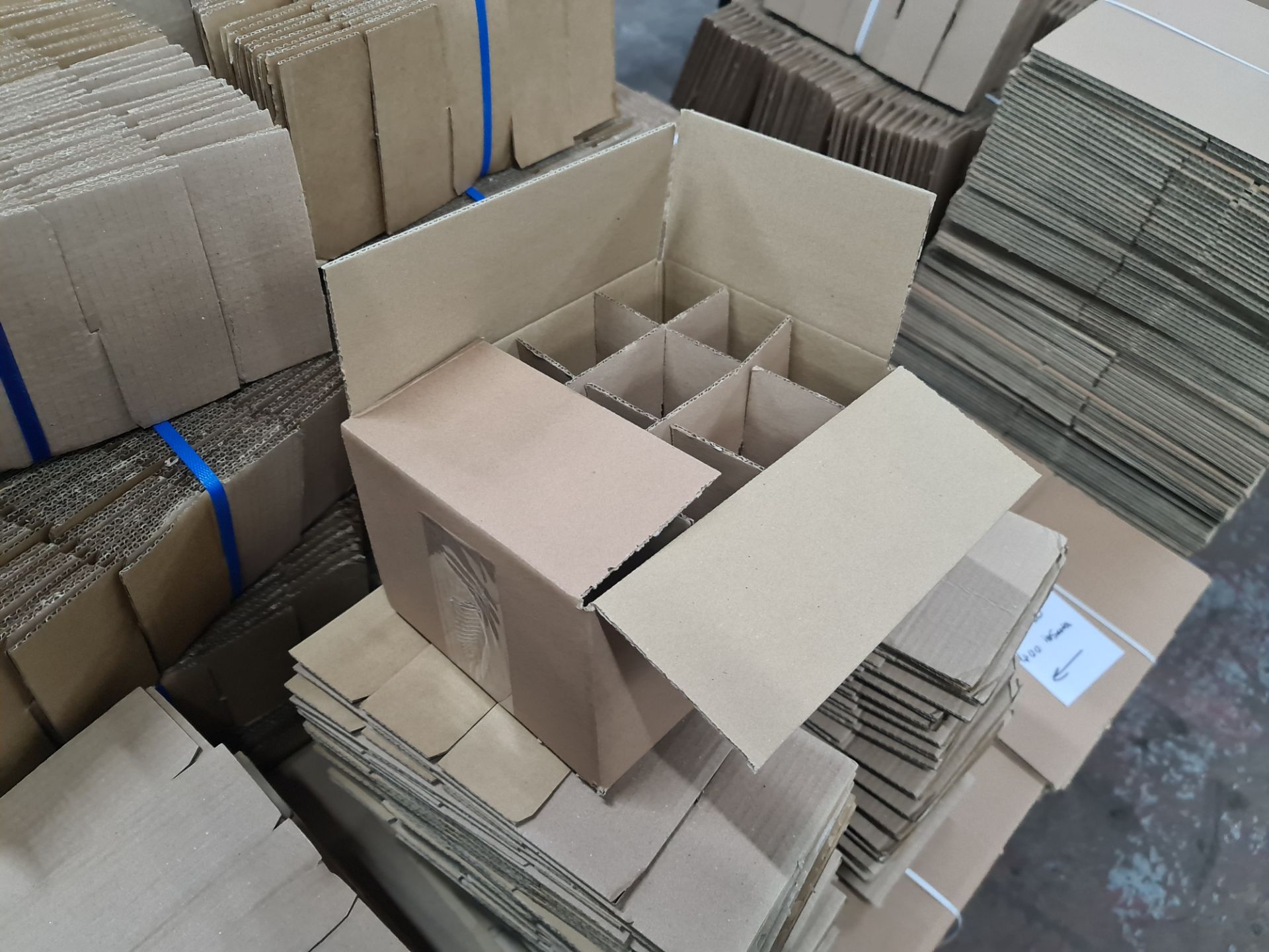 The contents of a pallet of cardboard boxes comprising approximately 120 boxes and 400 inserts; 266