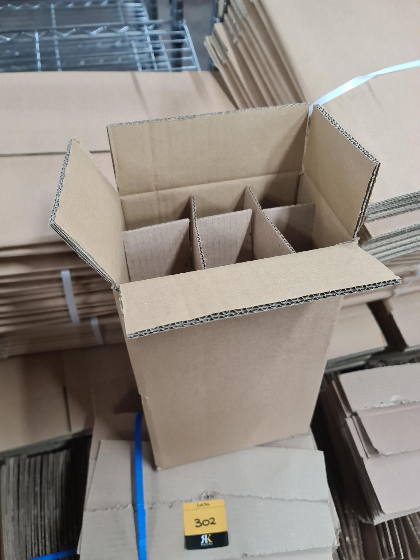The contents of a pallet of cardboard boxes and inserts, comprising approximately 200 boxes and 450