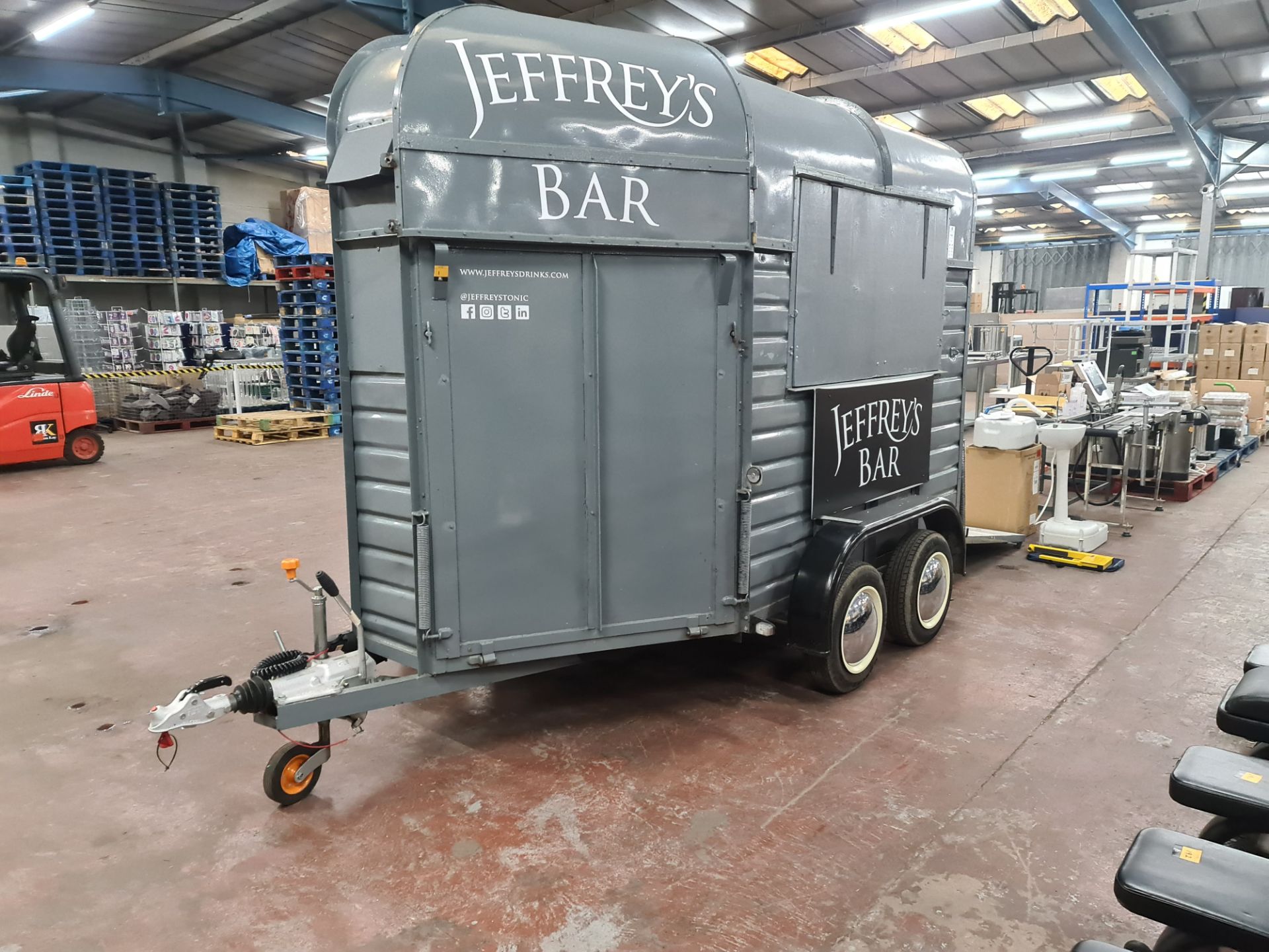 Horsebox trailer converted into mobile bar. This twin axle trailer has been fitted out with cupboar