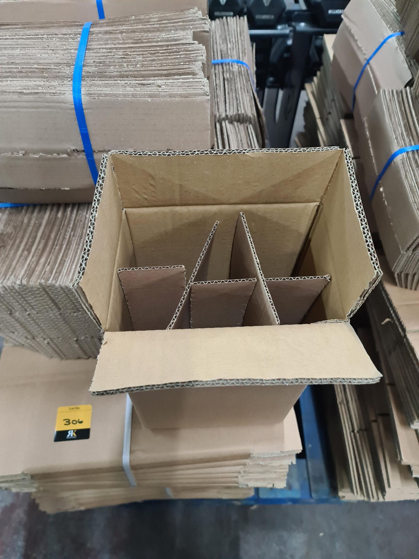 The contents of a pallet of cardboard boxes comprising approximately 300 boxes and 300 inserts; 200