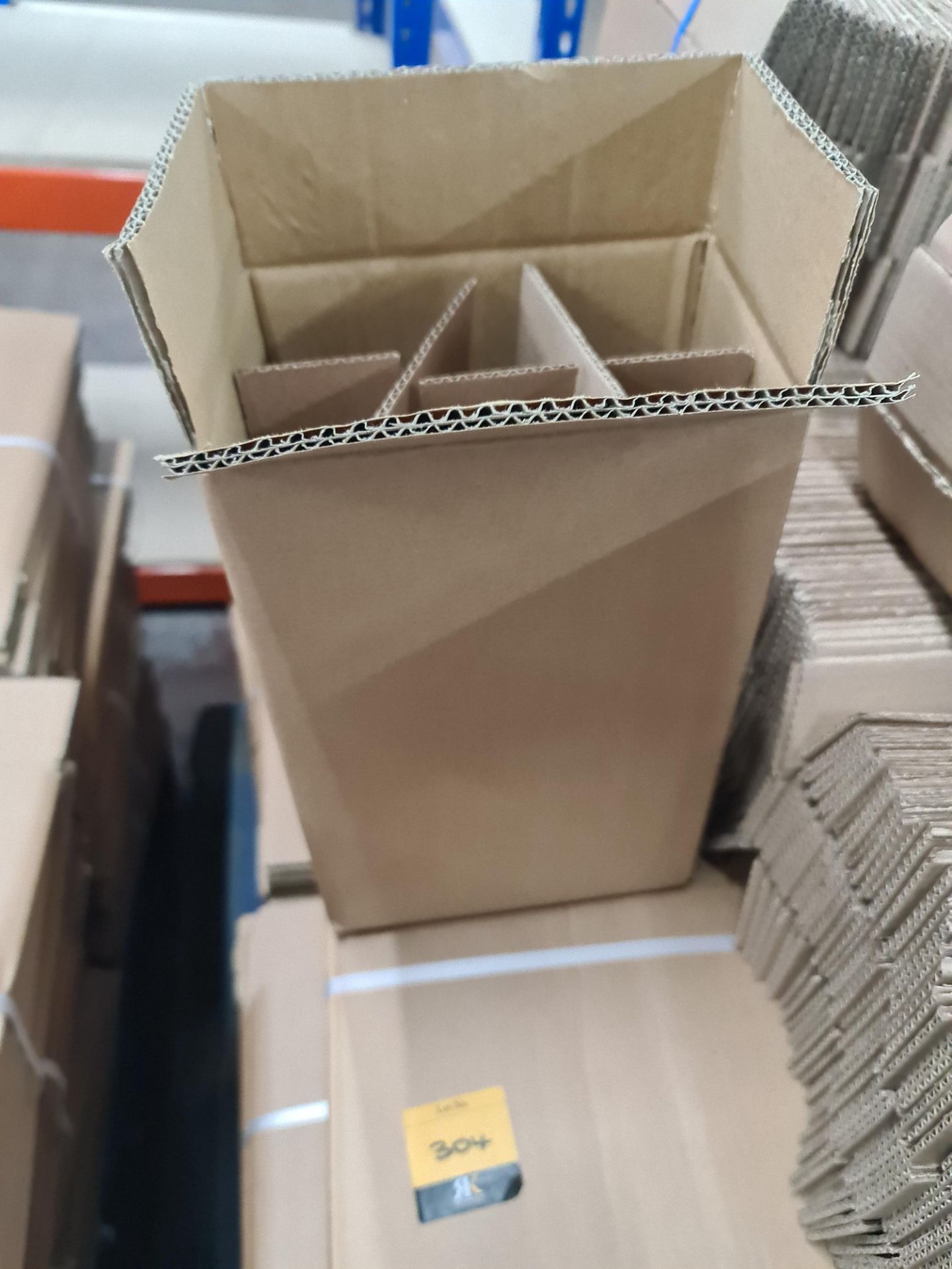 The contents of a pallet of cardboard boxes comprising approximately 300 boxes and 300 inserts; 200