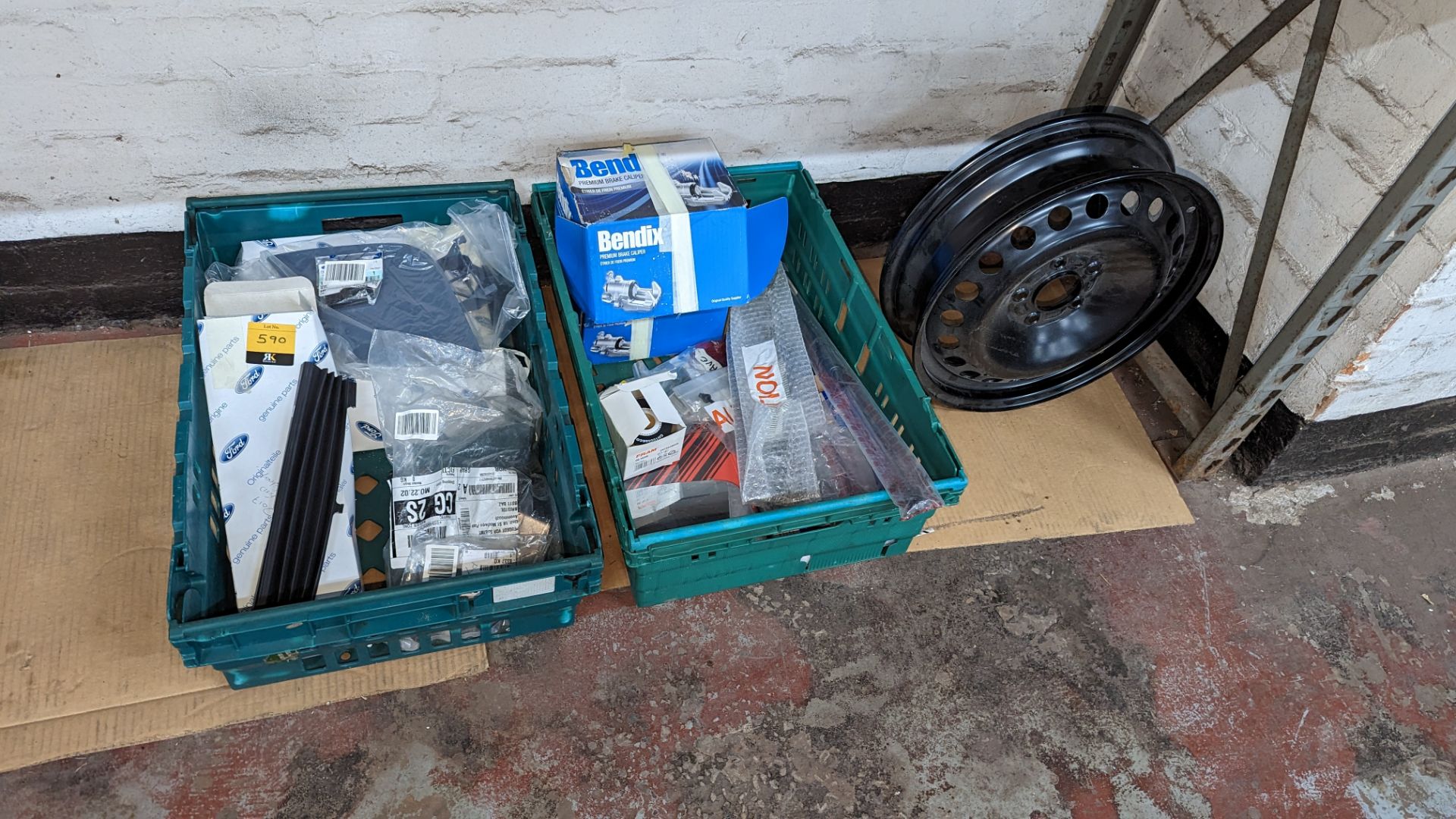 The contents of 2 crates of assorted car parts plus car wheel