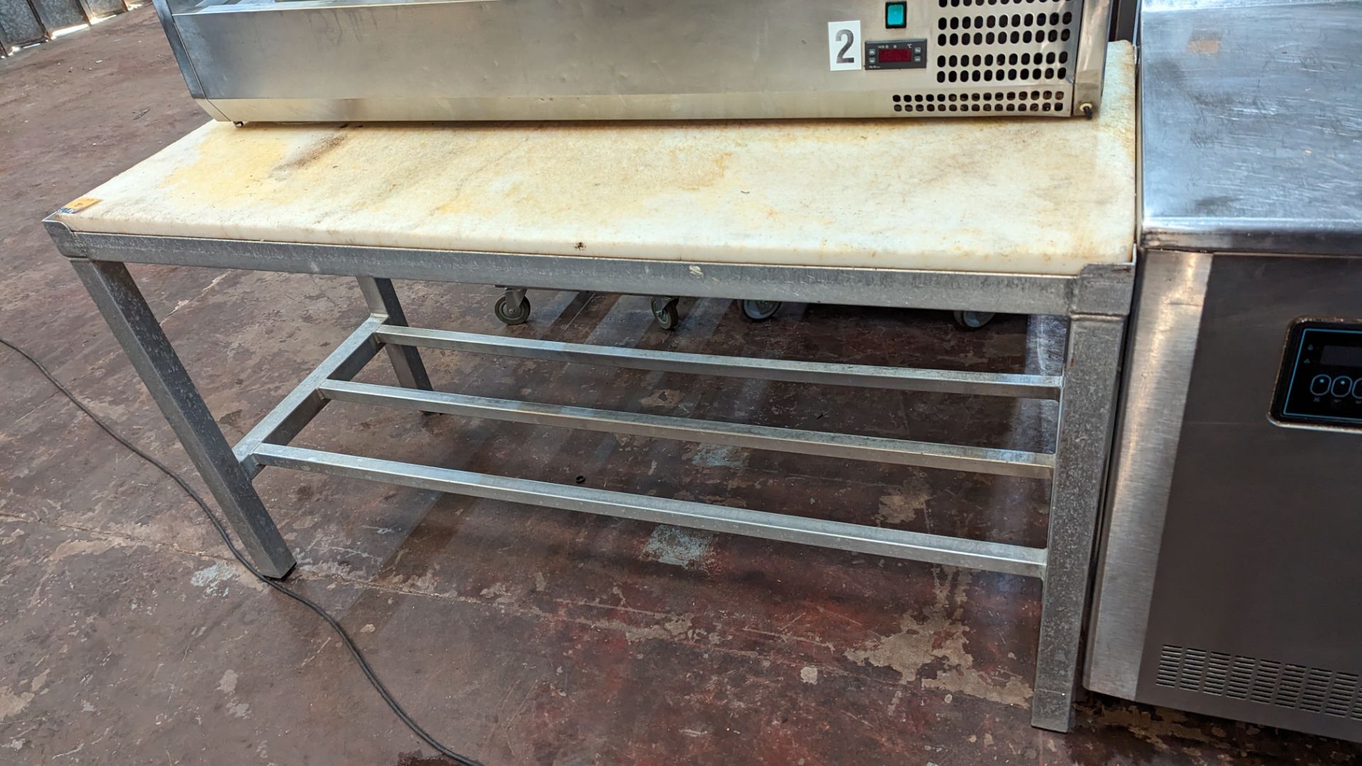 Floor standing chopping block comprising metal frame & synthetic top, measuring approximately 154cm