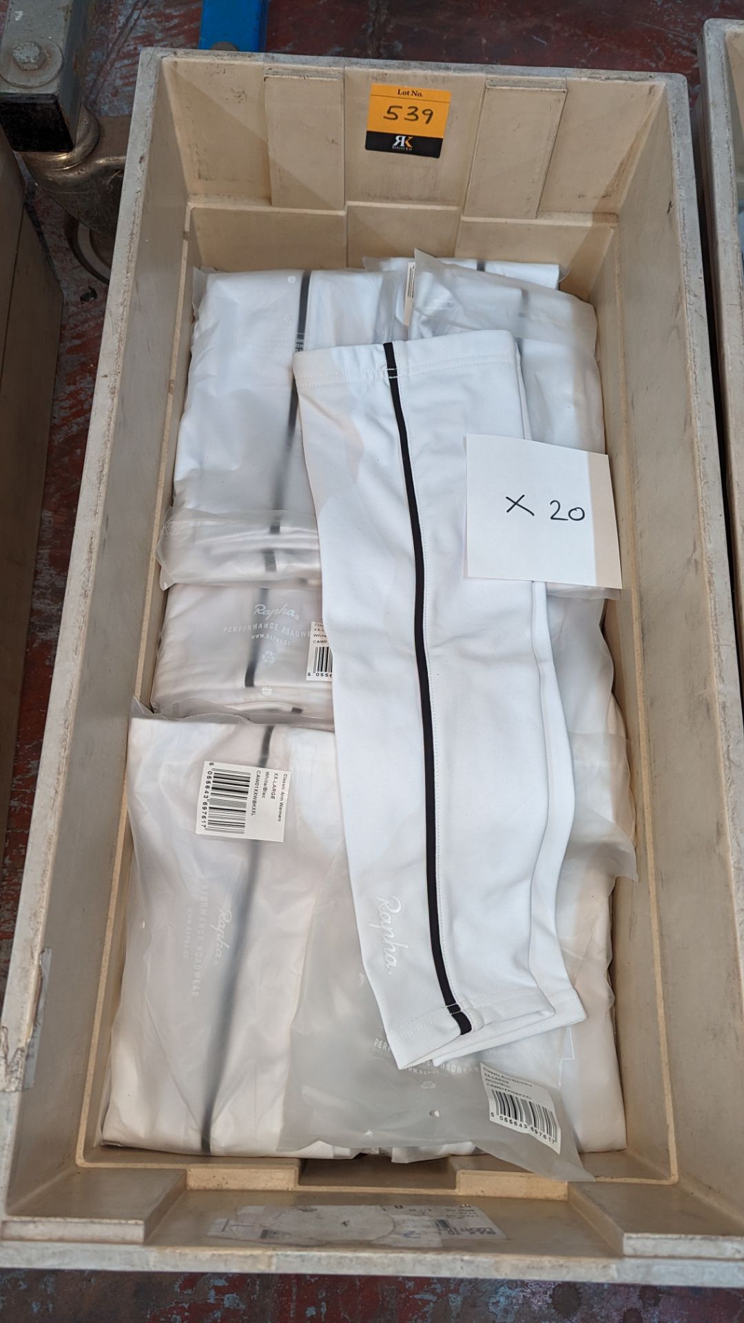 20 pairs of Rapha Cycling ladies arm warmers, in white with black detailing. These mostly appear to