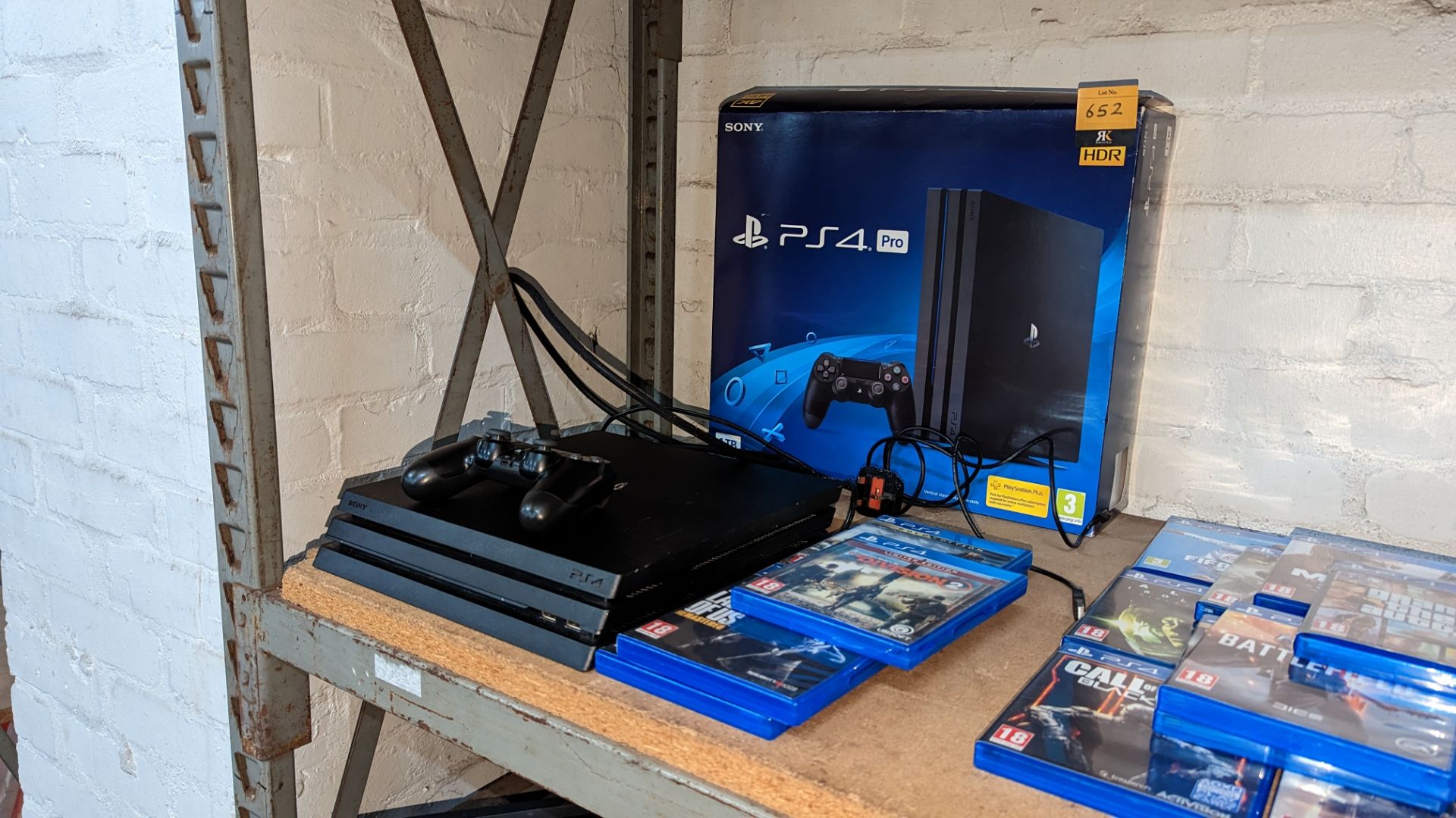 Sony PlayStation 4 Pro with controller, charging cable, original box & 5 off games as pictured