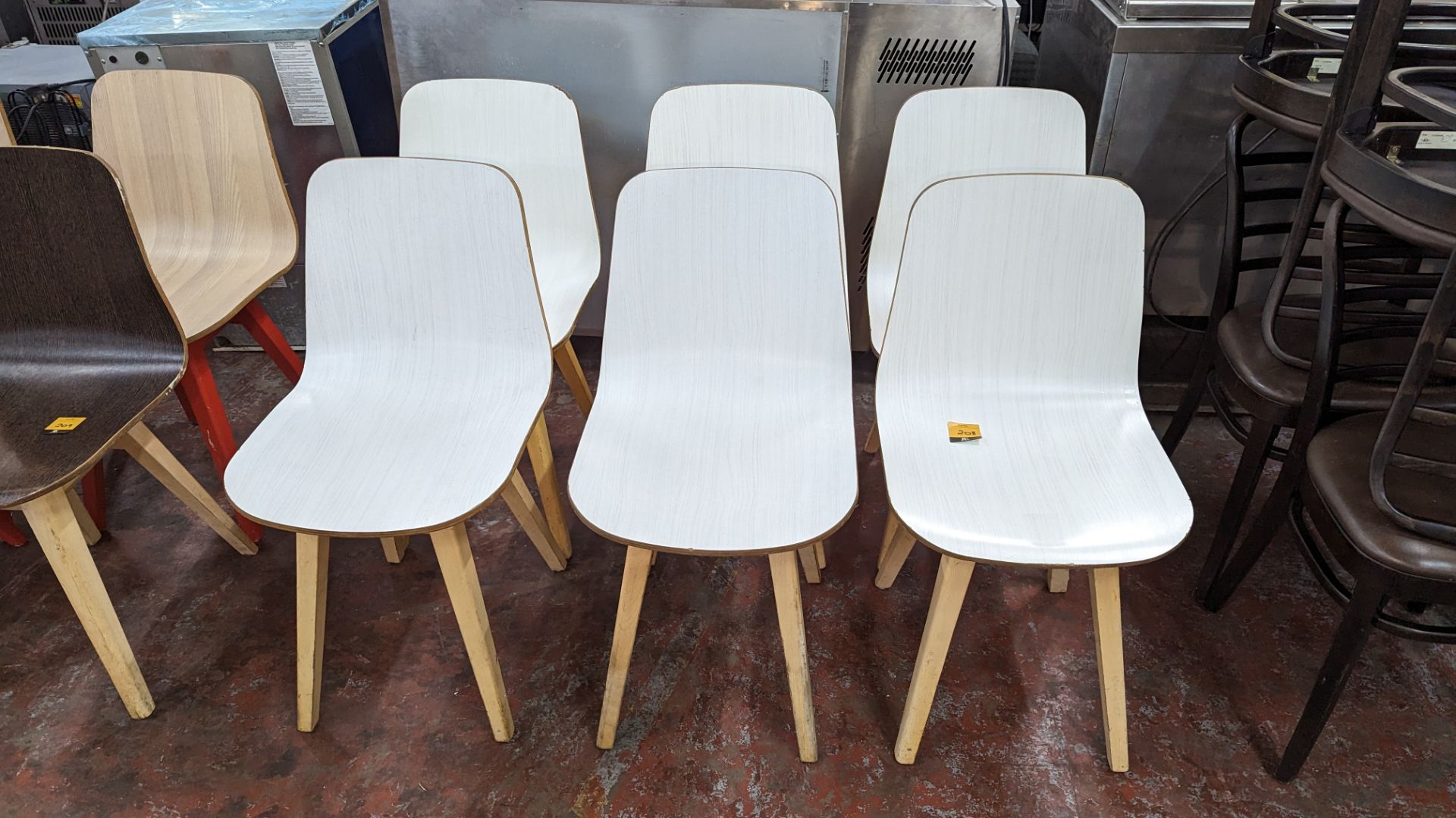 6 matching wooden chairs with white painted bases. NB these chairs look the same style, but a diffe
